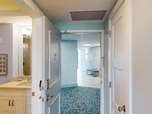 bathroom featuring tile patterned flooring and vanity