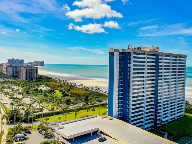 exterior space featuring a water view and a view of the beach