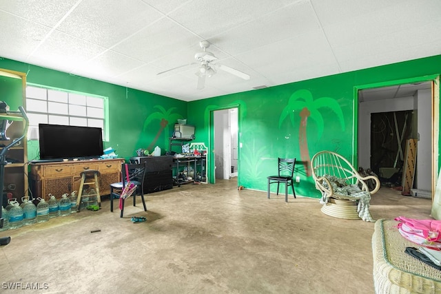 interior space with concrete flooring and ceiling fan