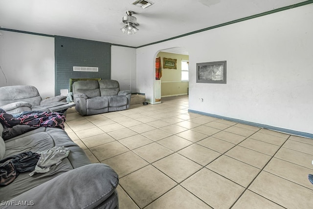 tiled living room with ceiling fan