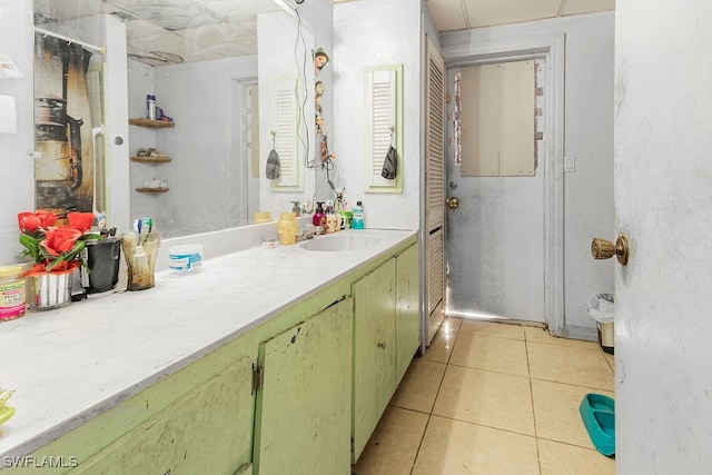 bathroom with vanity and tile patterned flooring