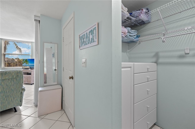 walk in closet featuring light tile patterned floors