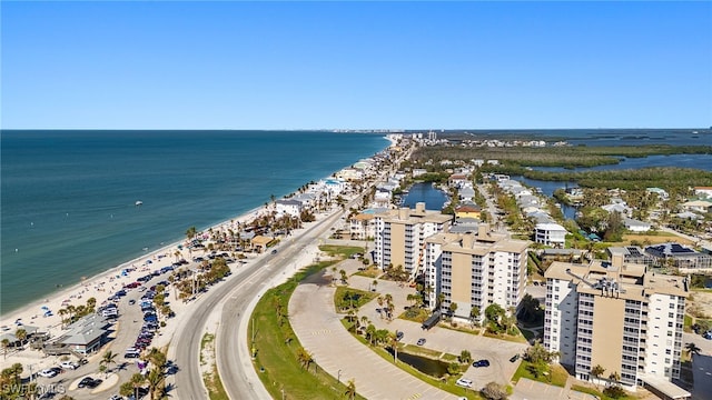 aerial view featuring a water view and a beach view