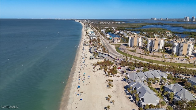 drone / aerial view with a water view and a view of the beach