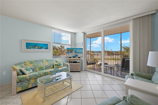 living room featuring light tile patterned floors and floor to ceiling windows