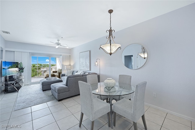 dining room with ceiling fan and light tile patterned flooring