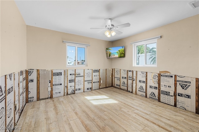 spare room featuring ceiling fan and light wood-type flooring