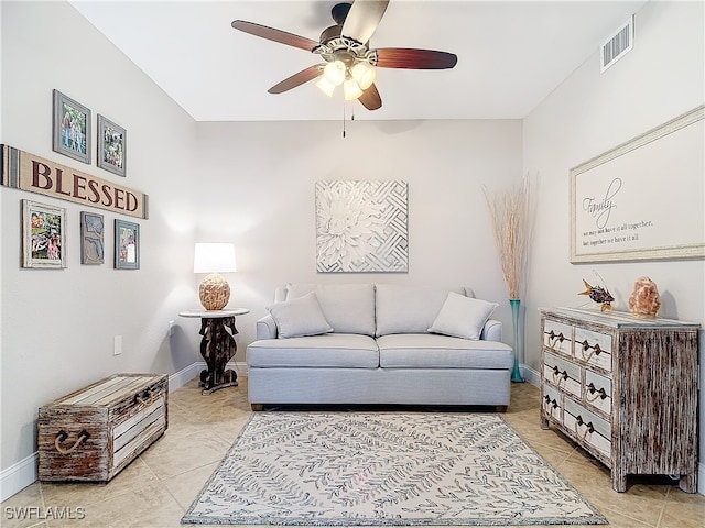 living room with ceiling fan and light tile patterned floors