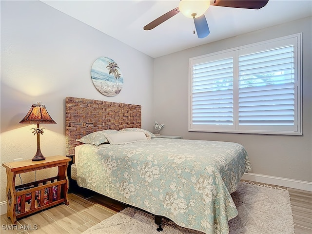 bedroom featuring hardwood / wood-style flooring and ceiling fan