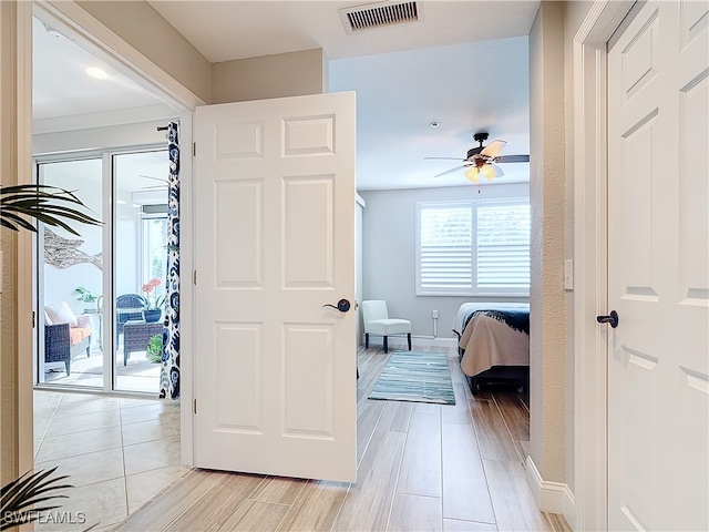 hall with light wood-type flooring