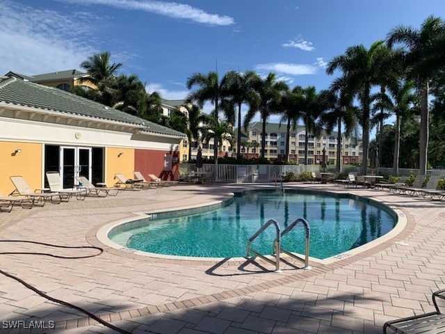 view of swimming pool featuring a patio area