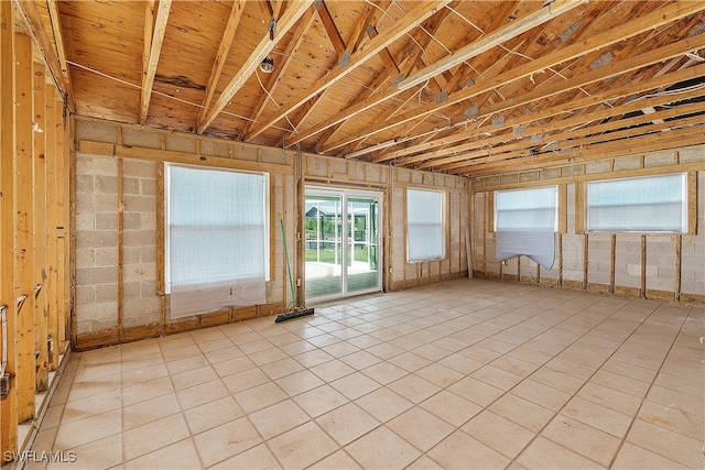 misc room with light tile patterned floors