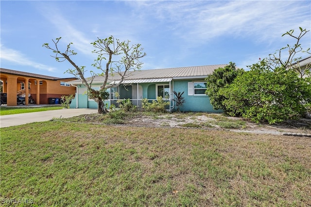 ranch-style house with a front lawn