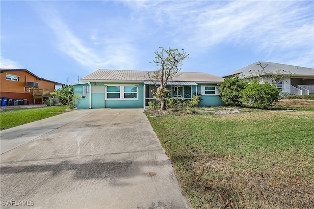 ranch-style home with a front yard