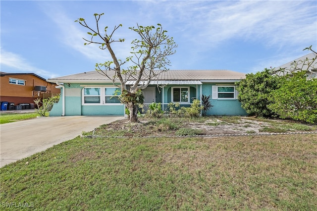 ranch-style home with a front yard