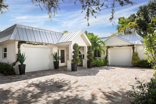 modern inspired farmhouse with a garage