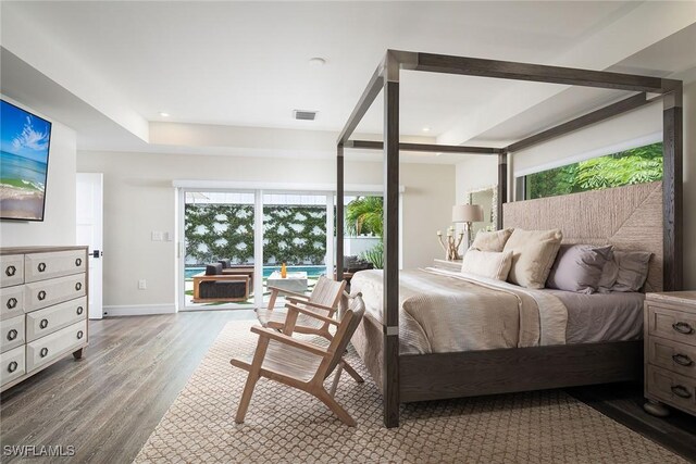 bedroom featuring access to exterior and wood-type flooring