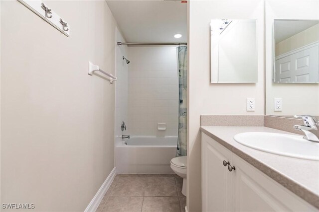 full bathroom featuring toilet, shower / bath combo, vanity, and tile patterned floors