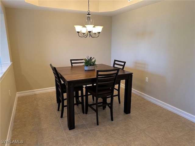 tiled dining room featuring a notable chandelier