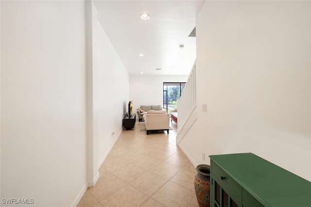 hallway featuring light tile patterned flooring