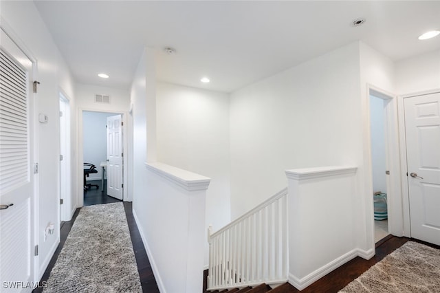 hallway featuring dark wood-type flooring