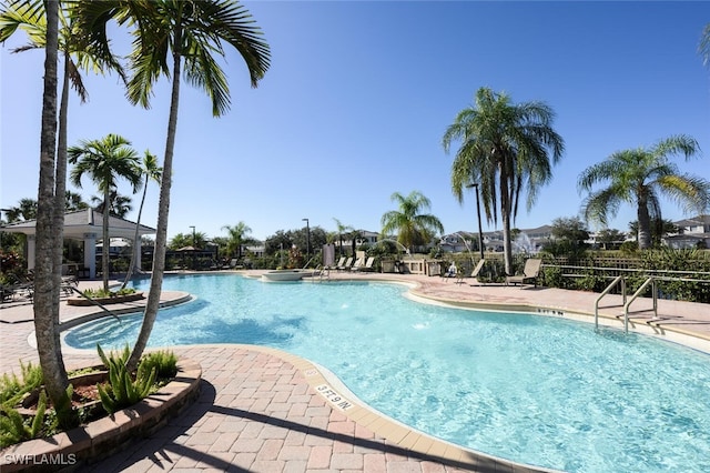 view of swimming pool featuring a patio area