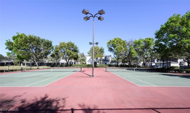 view of sport court featuring basketball hoop