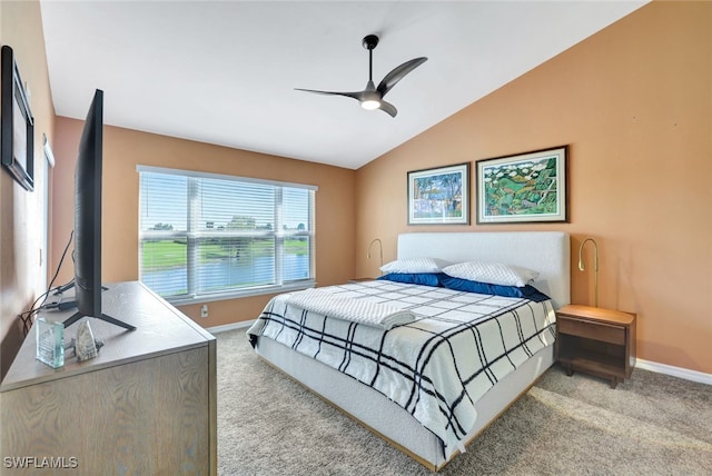 carpeted bedroom featuring vaulted ceiling and ceiling fan