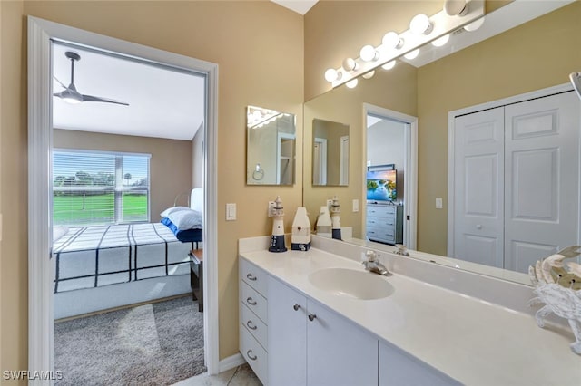 bathroom with ceiling fan and vanity