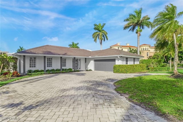 ranch-style home with a garage