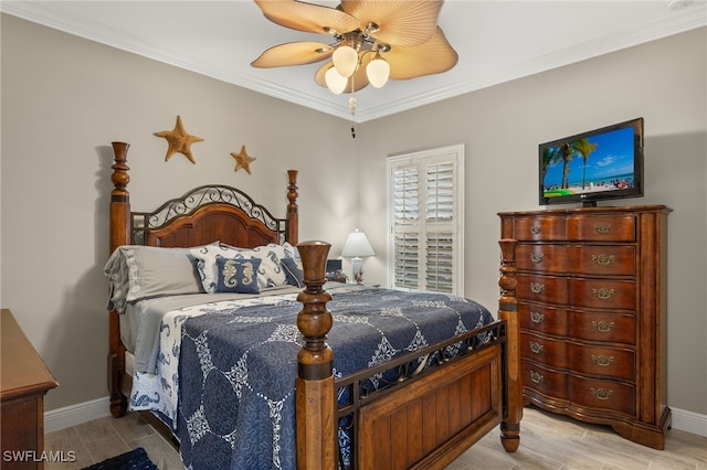 bedroom featuring ceiling fan and crown molding