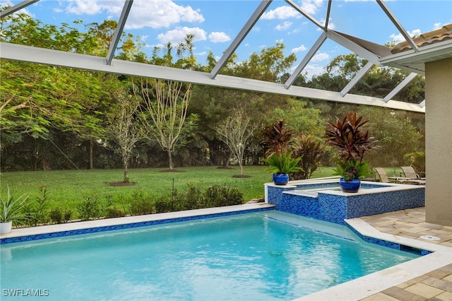 view of swimming pool with a yard and a lanai