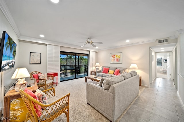 living room with light tile patterned floors, ceiling fan, and crown molding