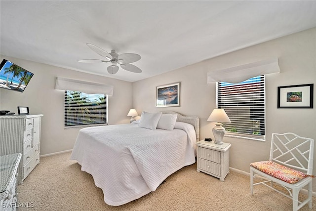 bedroom with ceiling fan and light colored carpet