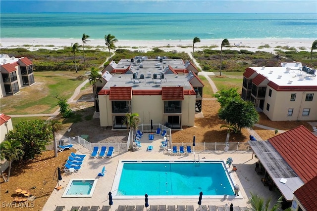 bird's eye view featuring a water view and a view of the beach