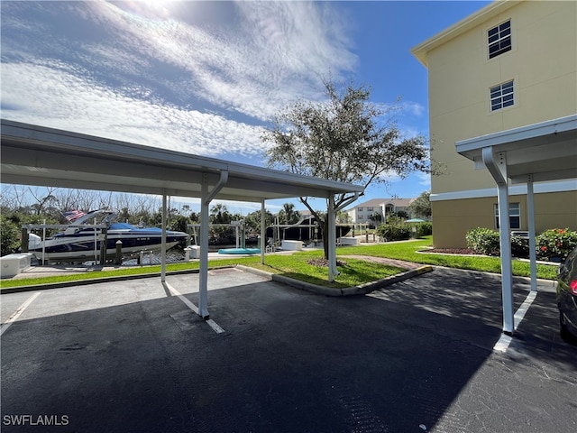 view of car parking featuring a yard