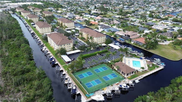 drone / aerial view featuring a water view and a residential view