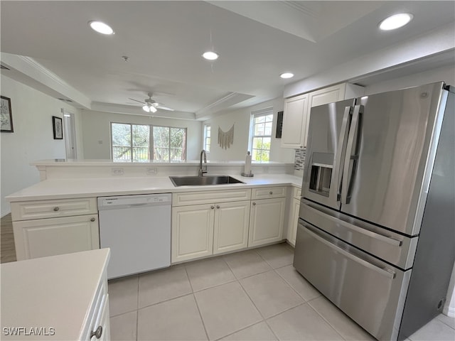 kitchen with stainless steel fridge with ice dispenser, white dishwasher, plenty of natural light, and sink