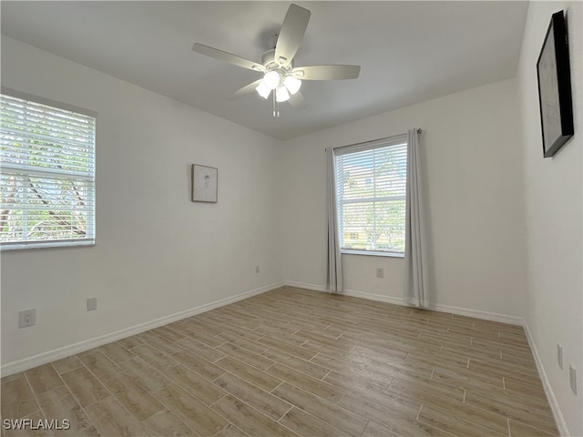 unfurnished room featuring ceiling fan and light hardwood / wood-style flooring