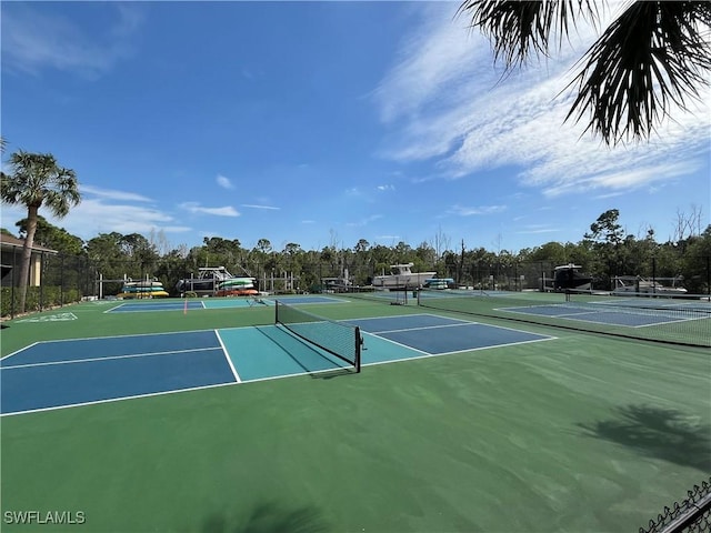 view of sport court with community basketball court and fence