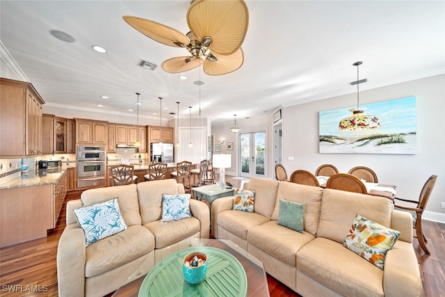 living room featuring ceiling fan, hardwood / wood-style floors, crown molding, and french doors