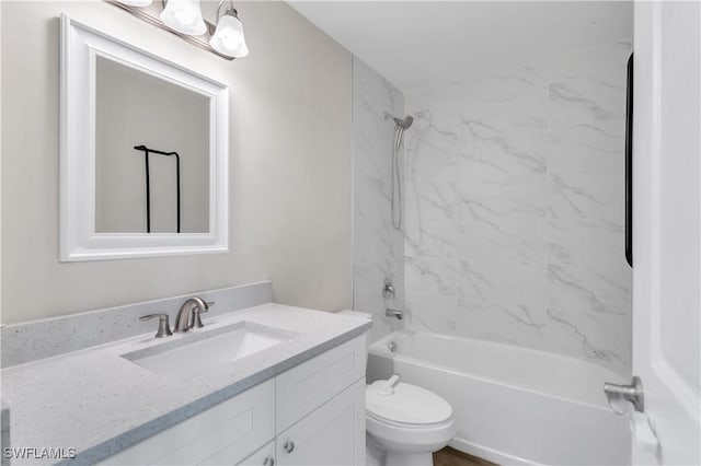 full bathroom with vanity, toilet, and tiled shower / bath