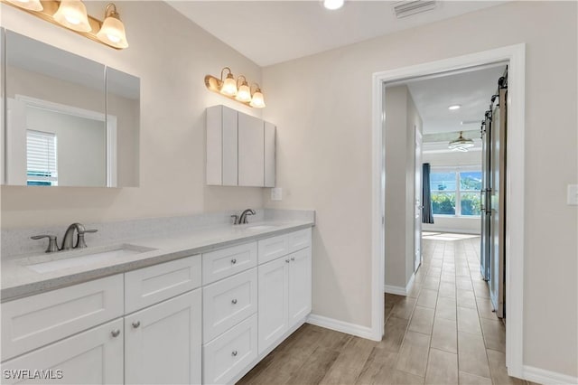 bathroom featuring vanity and wood-type flooring