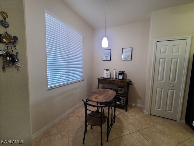 dining area featuring light tile patterned flooring