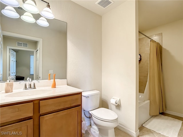 full bathroom featuring tile patterned floors, vanity, shower / bath combination with curtain, and toilet