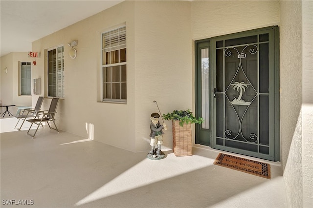 property entrance with covered porch