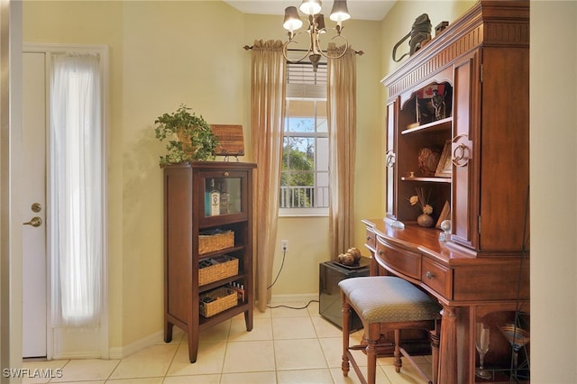 misc room featuring a chandelier and light tile patterned floors