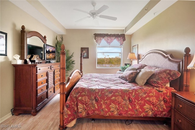 bedroom with ceiling fan and light hardwood / wood-style floors