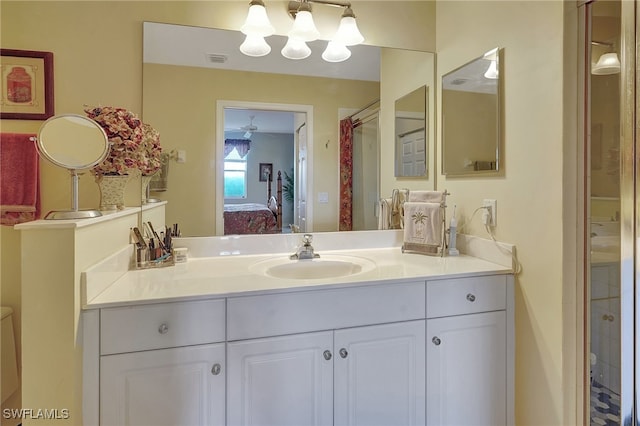 bathroom featuring a shower with curtain and vanity