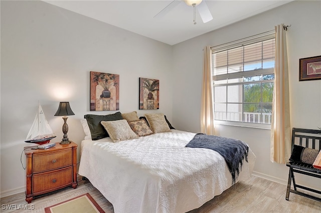 bedroom featuring light hardwood / wood-style flooring and ceiling fan